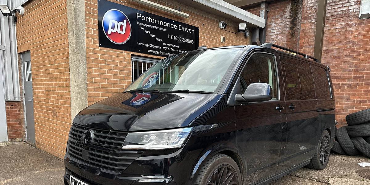 Performance Driven Volkswagen van outside the garage